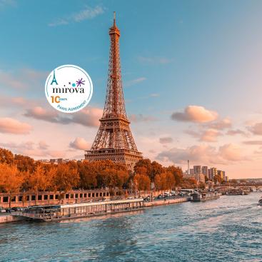 Paris and all of Europe is the Eiffel tower in the rays of the setting sun on the bank of Seine river with cruise tourist ships