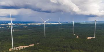 Onshore wind farm nestled in the heart of Swedish forests, equipped with state-of-the-art turbines to generate renewable and sustainable energy. A tangible illustration of the energy transition in Northern Europe