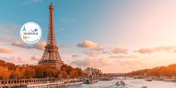 Paris and all of Europe is the Eiffel tower in the rays of the setting sun on the bank of Seine river with cruise tourist ships