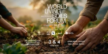 Hands planting young seedlings in fertile soil, illustrating soil regeneration, with the title ‘World Living Soils Forum